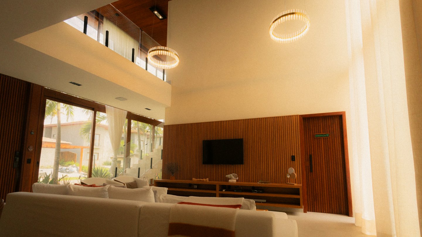 Modern living room with modular sofas and a wooden slat wall.